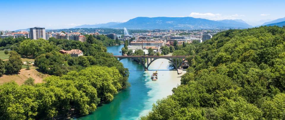 Confluence of the Rhône and Arve rivers in Geneva, with the jet and the Alps